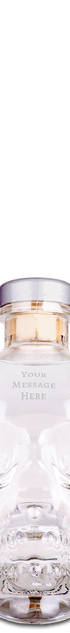 Crystal head vodka bottle on a white background with "your message here" engraved on the forehead.