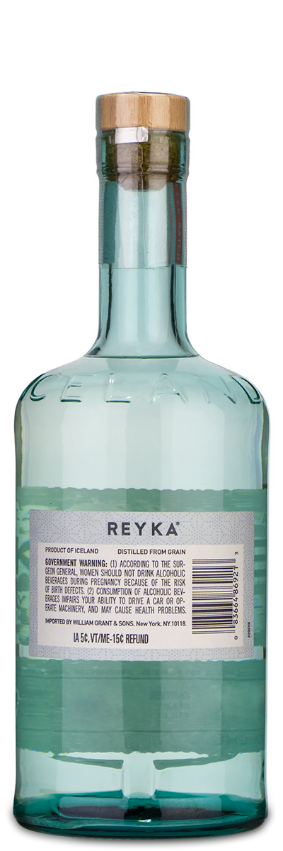 Reyka Vodka bottle with a wooden cap and visible back label, shown in clear glass.