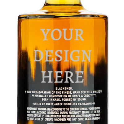 Bottle of Blackened whiskey from the back, with "Your design here" engraved above the rear distillery label.