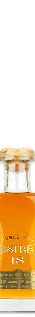 WhistlePig 18 Year Straight Rye Whiskey bottle with a cork stopper and gold label.