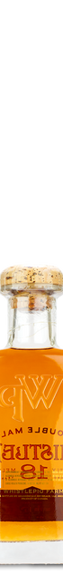 WhistlePig 18 Year Straight Rye Whiskey bottle with cork, filled with amber liquid, on a white background.
