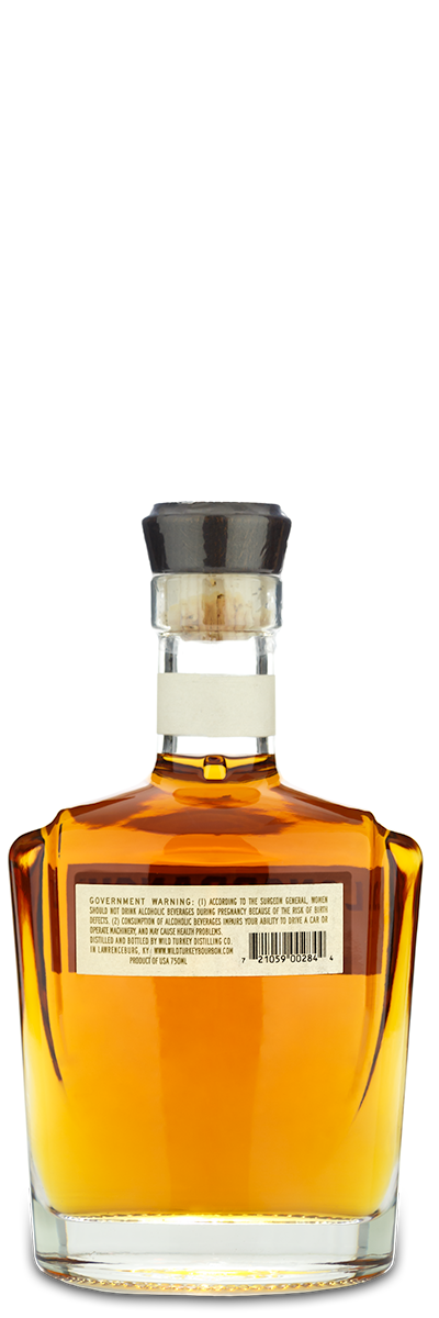 WildTurkey Longbranch Bourbon bottle, amber liquid, black cap, viewed from the back showing a warning label.