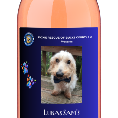 A bottle of personalwines Doxie Rescue | Lukas Sams Savasana California Rosé with a blue dog label.