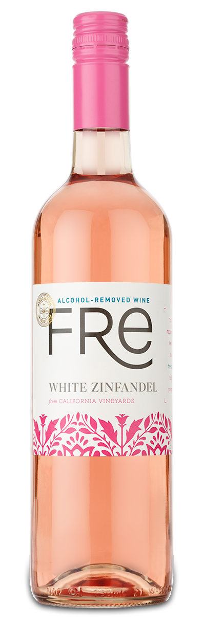 A bottle of Fre White Zinfandel (Alcohol Removed) with a pink cap and a custom wine label with pink designs.
