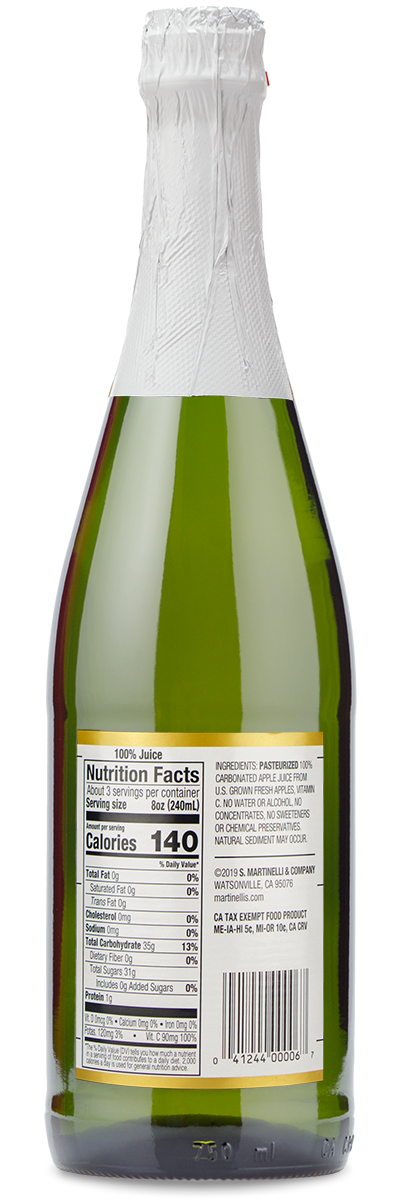 A green glass bottle of Martinellis Sparkling Apple Cider with white foil and a 100 juice nutrition label.