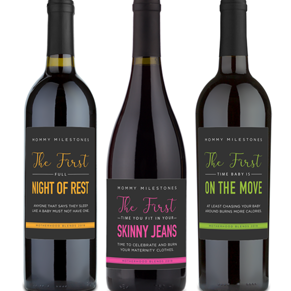Three wine bottles with humorous Mommy Milestones labels: Night of Rest, Skinny Jeans, and On the Move.