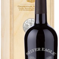 A Silver Eagle Napa Red Blend wine set sits in front of a box decorated with an eagle emblem.