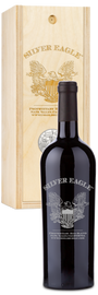 A Silver Eagle Napa Red Blend wine set sits in front of a box decorated with an eagle emblem.