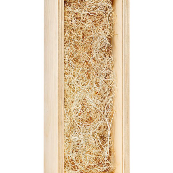 A single-bottle wood wine box with custom engraving, shown open and filled with light shredded paper packing.