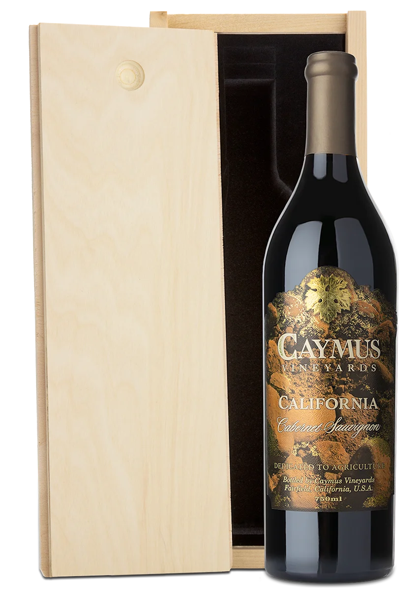 A bottle of Gaymus Vineyards California Cabernet Sauvignon next to its light natural wood presentation box on a white background.