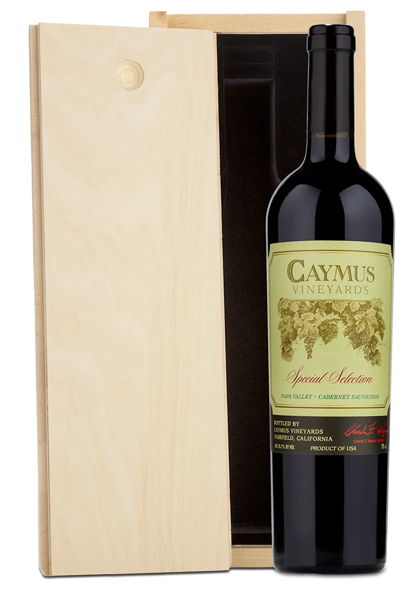 A wooden Caymus box set containing a bottle of Special Selection Cabernet.