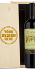 A custom-engraved wooden Caymus box set containing a bottle of Special Selection Cabernet.