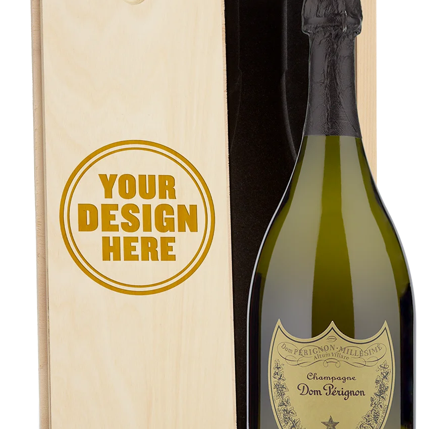 A Dom Perignon Champagne bottle displayed in a custom-engraved wooden wine box.