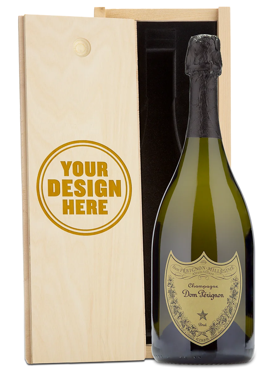 A Dom Perignon Champagne bottle displayed in a custom-engraved wooden wine box.