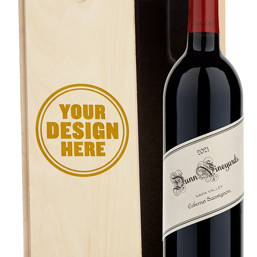 A bottle of 2021 Dunn Vineyards Napa Valley Cabernet Sauvignon with a custom engraved wooden wine box.