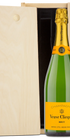 Open wood box with Veuve Clicquot Champagne bottle inside, lid propped up to display the bottle.