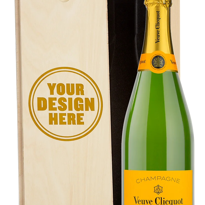 A Veuve Clicquot champagne bottle in a wood gift box with an engraved lid showing personalized text.