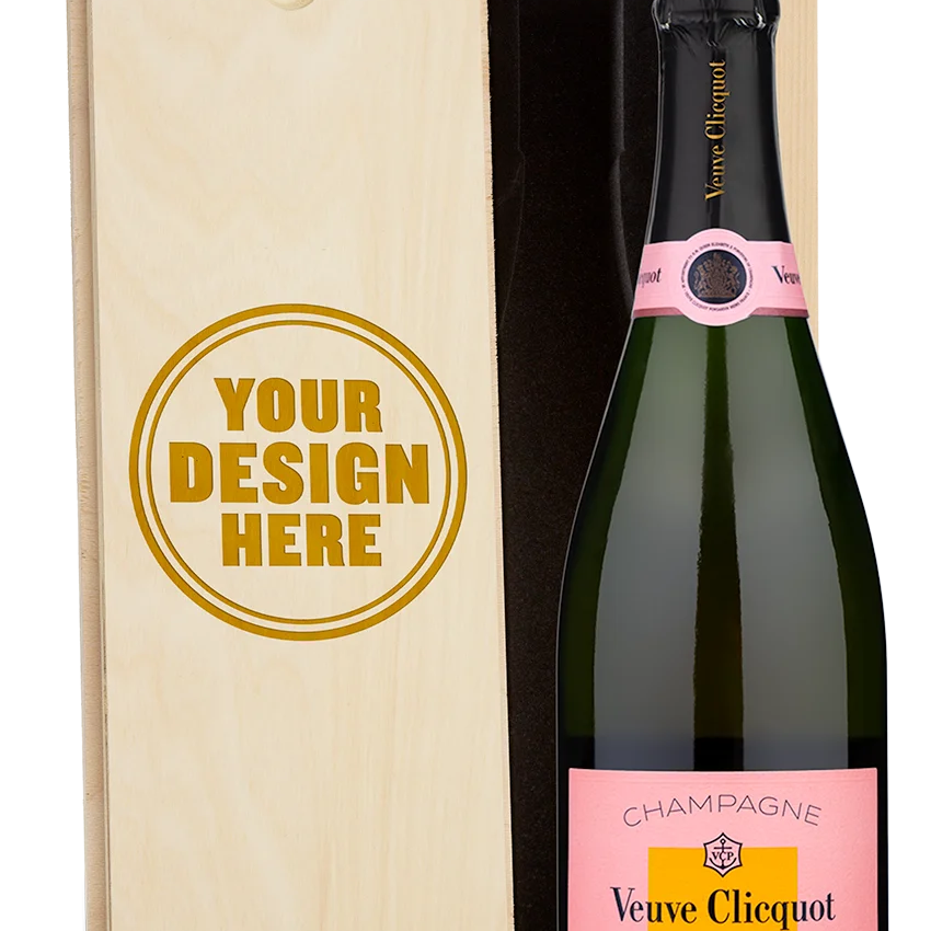 A Veuve Clicquot rose champagne bottle in a wooden box engraved with Your Design Here on the lid.