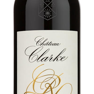 A bottle of 2015 Chateau Clarke Red Blend by ever with a white and gold label and a red foil cap.