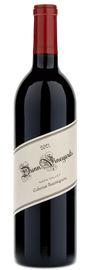 A bottle of Dunn Vineyards 2021 Napa Valley Cabernet Sauvignon with a red foil cap and slanted cream label.