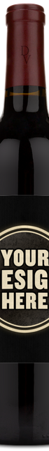 A dark Duckhorn wine bottle with a maroon cap and a label reading "Your Design Here."
