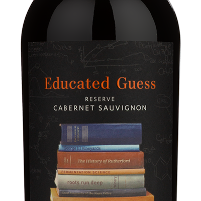A bottle of Educated Guess Reserve Cabernet Sauvignon from Rutherford, Napa Valley, 2019. The bottle is dark glass with a black label featuring a graphic of stacked books and orange and white text.