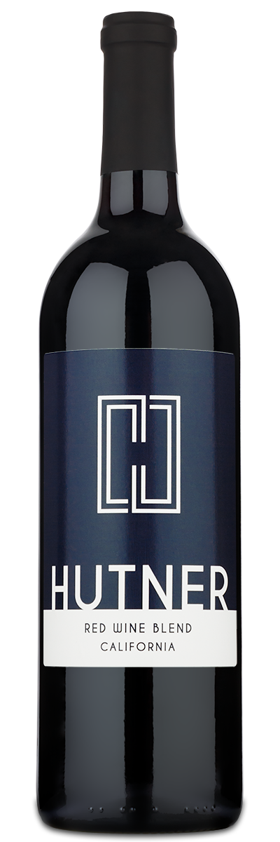 A bottle of personalwine Hutner Red Wine Blend with a modern white custom label on a dark blue background.