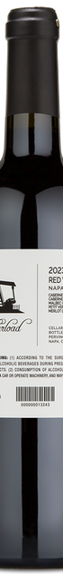 A bottle of Motherload Red Wine Blend with a winery label detailing its blend and Napa Valley origin.