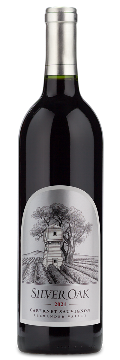 A bottle of Silver Oak 2021 Alexander Valley Cabernet Sauvignon with a vineyard and water tower illustrated on the label.