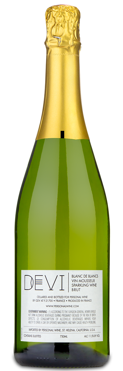 A bottle of Devi Blanc de Blancs sparkling wine with a gold foil top and a white label.