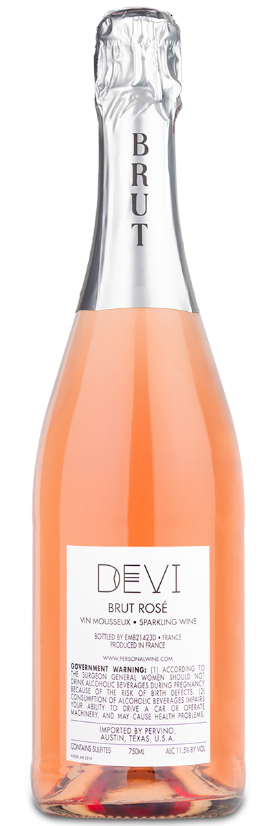 A pink sparkling rosé bottle with a silver foil top labeled Devi Brut Rose.