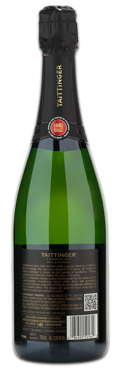 A green bottle of taittinger Taittinger Brut Champagne with a custom engraved wine label, shown from the back.