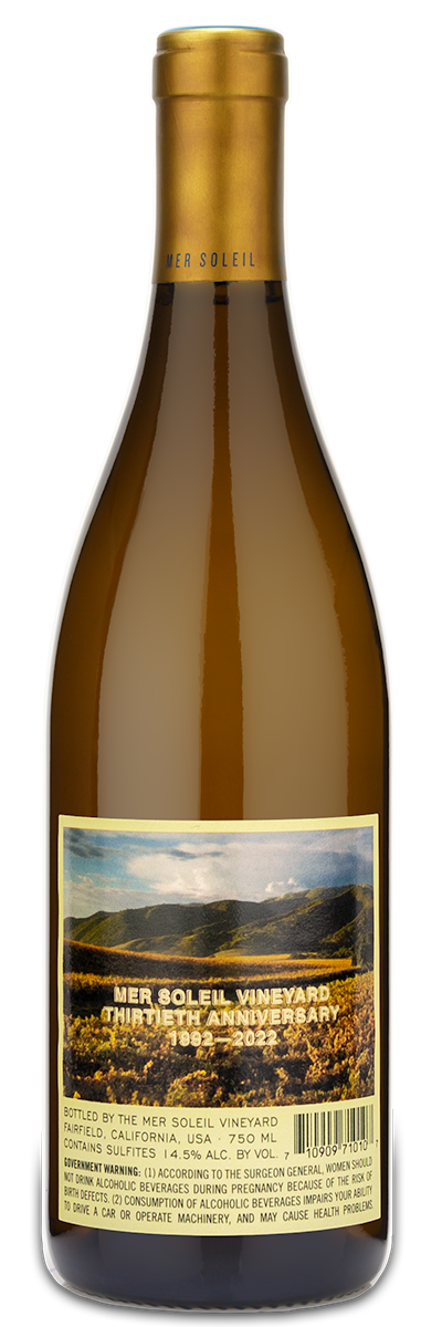Mer Soleil Chardonnay wine bottle with gold cap and a vineyard label, Santa Lucia Highlands visible.