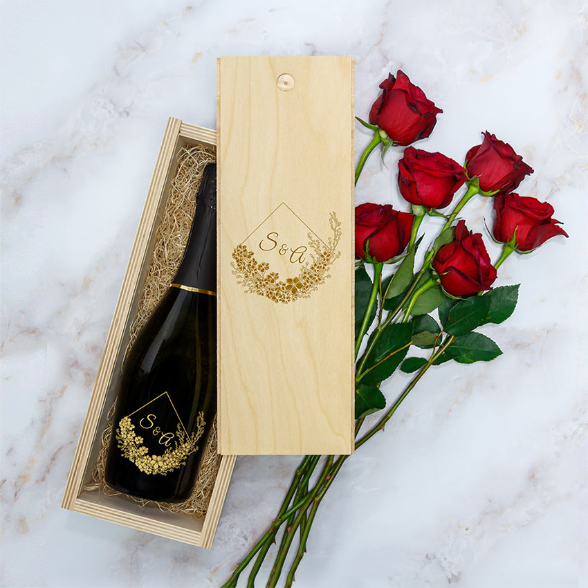 Engraved wooden wine box with a personalized wine bottle, six red roses, and gold floral decorations.