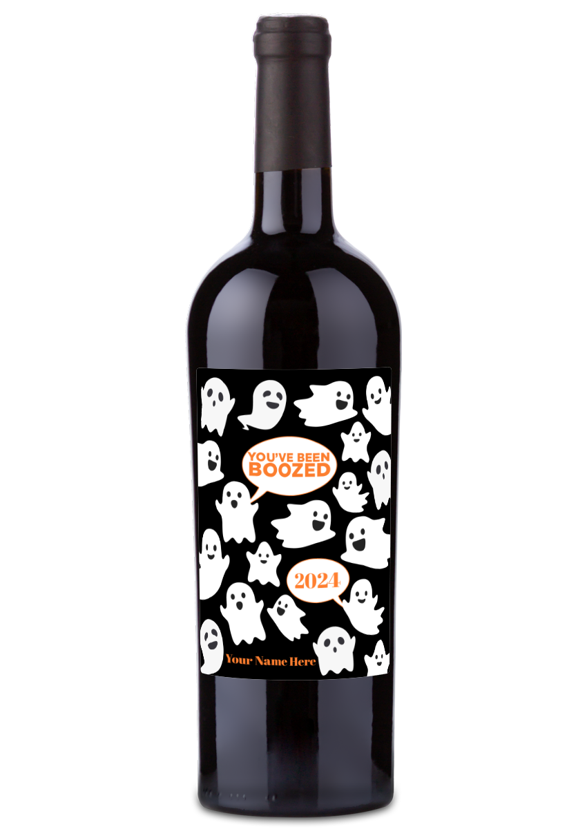 A wine bottle with a black label featuring white ghosts and the text You’ve Been Boozed.
