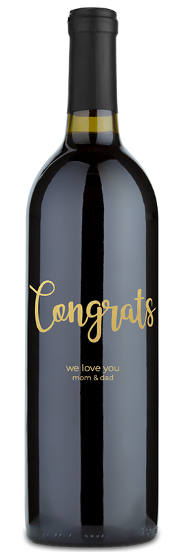A wine bottle with gold text that says, Congrats, we love you mom & dad.