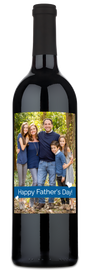 Bottle of wine with a heart-shaped photo label featuring a smiling family, titled for Fathers Day.