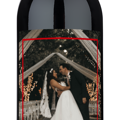 Personalized wine bottle labeled LOVE - natalie & rahul with a wedding photo in a Love Frame.