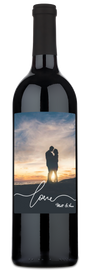 Wine bottle with custom label showing a couple kissing and the word love written below them.