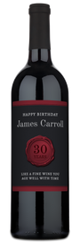 Custom wine bottle with a wax seal and birthday label reading Happy Birthday James Carroll, 30 Years.