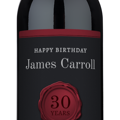 Custom wine bottle with a wax seal and birthday label reading Happy Birthday James Carroll, 30 Years.