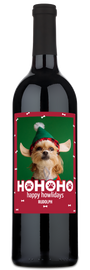 Wine bottle with a label showing a dog wearing antlers and Happy Howlidays holiday greeting.