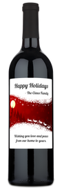 A wine bottle with a holiday label reading Happy Holidays - The Claus Family in festive lettering.