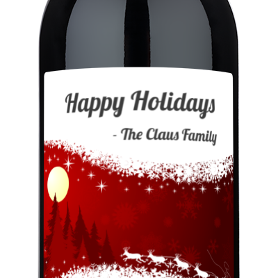 A wine bottle with a holiday label reading Happy Holidays - The Claus Family in festive lettering.