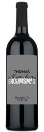 Custom “Will You Be My Groomsman?” wine bottle for Thomas, Houston TX 12.01.24, on a plain gray background.