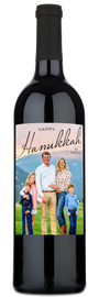 A wine bottle with a Hanukkah-themed label featuring a family photo and space for a personalized holiday message.