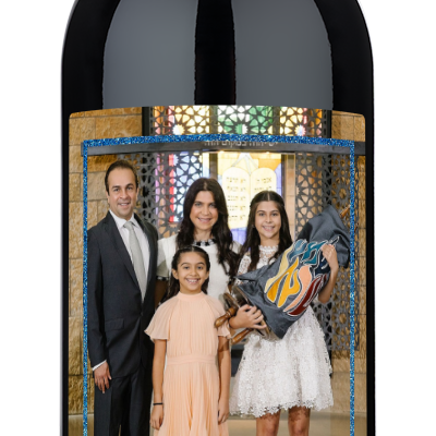 Wine bottle with a custom family photo label and Happy Hanukkah 2024 text.