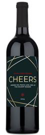 A wine bottle with a festive Cheers Holiday label reading Wilson Family Reserve 2024 and holiday wishes.