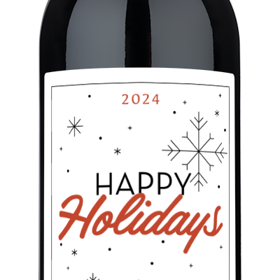 Wine bottle with a snowflake holiday label reading Happy Holidays Jackson Family 2024.