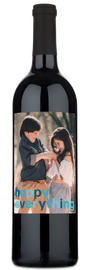 Two smiling children on a wine label with cheerful blue and orange Happy Everything text.